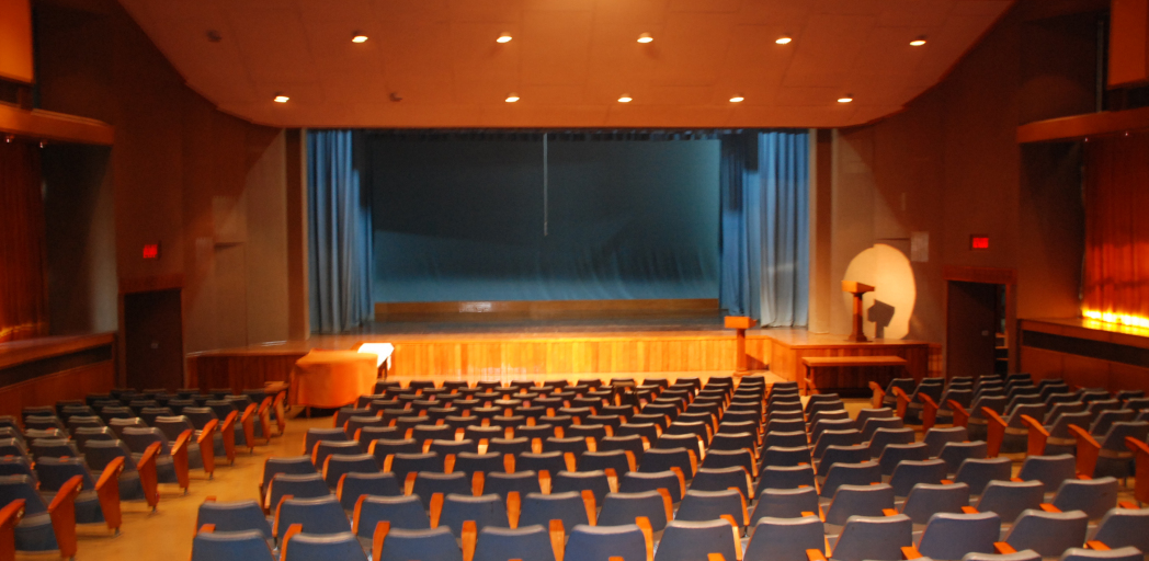 View of the auditorium from the back with lights on